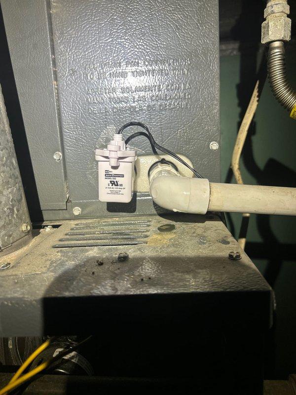 Installed condensate overflow safety switch on 14-year-old Goodman HVAC system to prevent water damage by automatically shutting down the unit when the drain pan backs up. Replaced failed 20 MFD brand-specific capacitor for the upstairs blower motor to restore proper system operation.