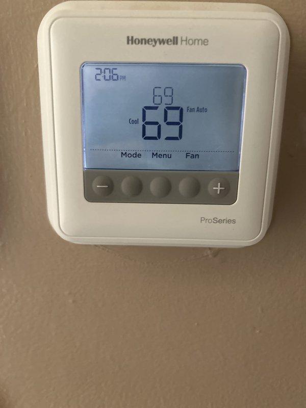 Responded to no cooling call on 5-year-old air conditioning system with indoor blower short cycling issue. Upon arrival, found unit located in basement experiencing repeated start-stop cycles lasting only a few seconds each. Performed diagnostic evaluation of the gas furnace/AC combination unit and thermostat operation. Inspected blower motor, control board, flame sensor, and electrical connections. Verified thermostat settings on Honeywell ProSeries unit set to cooling mode at 69 degrees. Examined accessible ductwork and system components through floor access panel. Customer had recently changed filter within 1-2 days prior to service call, ruling out airflow restriction as primary cause. Identified and resolved short cycling condition, restoring normal blower operation and cooling function to the system.