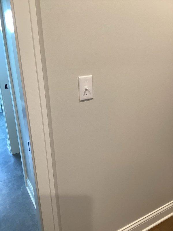 Conducted on-site electrical assessment for installation of new receptacle to power furniture and electronics in residential living room. Evaluated existing electrical infrastructure, including current switch locations and wall configurations near white sectional sofa placement. Determined optimal routing path for new circuit to accommodate couch-mounted devices and additional electrical items while maintaining code compliance and minimizing visible conduit runs. Assessed load requirements and verified panel capacity for proposed receptacle installation.