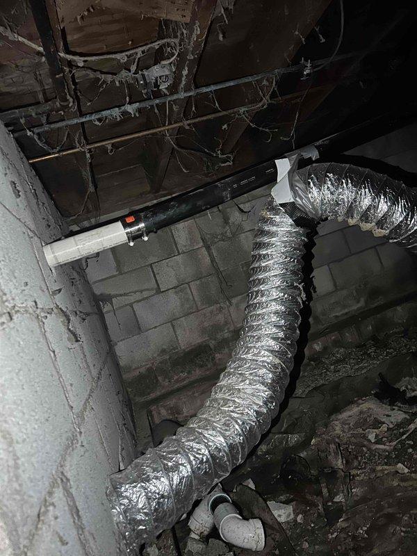 Completed kitchen drain reroute in basement mechanical area. Installed new PVC drainage piping to redirect kitchen waste line, integrating with existing plumbing infrastructure and ensuring proper pitch for drainage flow. All connections secured and tested for leaks.