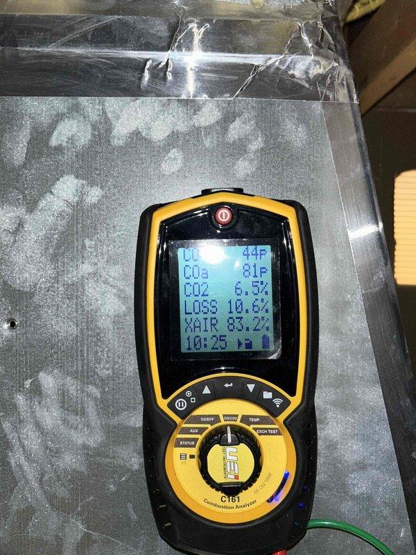 Completed HVAC maintenance inspection on basement air conditioning unit and gas furnace system. Diagnostic testing revealed severe evaporator coil icing with temperature readings showing 44°F coil temperature and 81-83°F ambient conditions, indicating restricted airflow or potential refrigerant issues. Documented 20x25 filter size for customer reference, with homeowner providing their own replacement filters. Captured diagnostic meter readings and photographed frozen coil condition for service records.