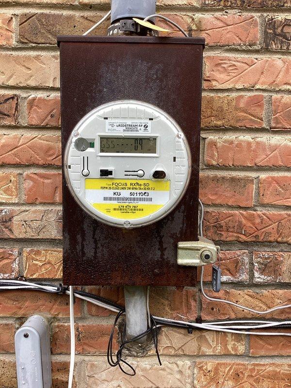 Conducted site evaluation for installation of customer-supplied 24KW residential standby generator unit. Assessed existing electrical service infrastructure including main meter location, available mounting space on exterior brick wall, and current utility connection configuration. Documented existing electrical panel access, conduit routing pathways, and determined optimal generator placement adjacent to existing meter and service equipment. Evaluated requirements for transfer switch installation, load center integration, and necessary electrical connections to accommodate automatic transfer system. Identified conduit paths for generator feed lines and verified adequate clearances per manufacturer specifications and local code requirements for generator installation on residential structure.