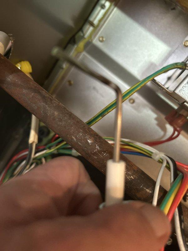 Completed routine maintenance tune-up on eleven-year-old furnace and air conditioning systems located in basement. During inspection, discovered significant corrosion on refrigerant line requiring attention. Performed standard system checks, cleaned components, verified electrical connections, and documented equipment condition with photos for customer records.