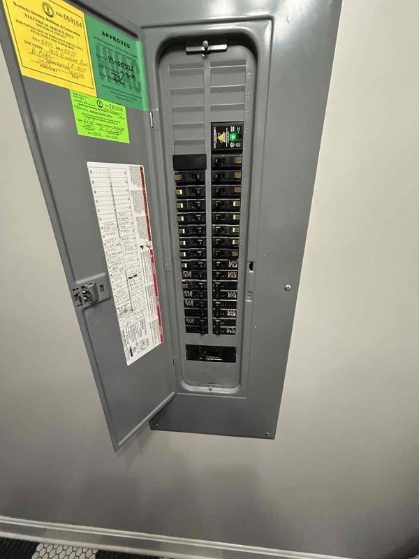 Conducted on-site electrical assessment for Level 2 EV charging station installation. Evaluated existing electrical panel located in first-floor laundry room to determine capacity and routing requirements for 240-volt circuit to garage charging location. Documented panel configuration and photographed current breaker layout for estimate preparation.
