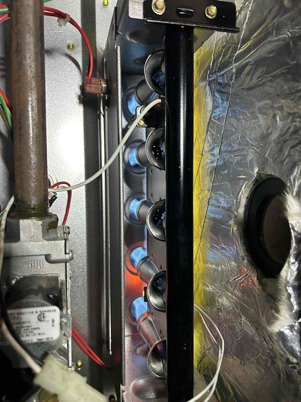Performed routine HVAC maintenance on air conditioning and gas furnace system located in crawlspace. Conducted thorough inspection of air handler unit, verifying proper electrical connections and terminal integrity. Examined burner assembly and heat exchanger, confirming proper combustion with visible flame pattern. Checked humidifier operation as part of standard maintenance protocol. Verified all electrical wiring and control components functioning correctly. Customer providing 20x25x4 air filters for system.