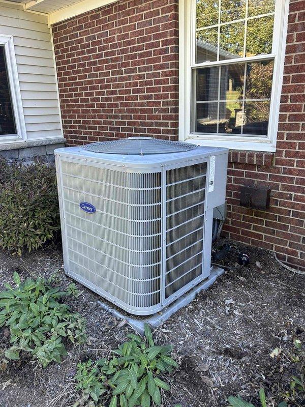 Performed comprehensive preventive maintenance service on residential Carrier air conditioning system. Conducted visual inspection of outdoor condensing unit, verified proper installation and clearances, and measured operating amperage at 29.55 amps to confirm system is drawing within normal parameters. Unit found in good operating condition with all components functioning as designed.
