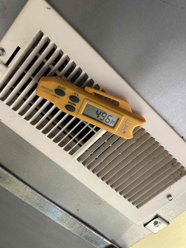 Completed preventative maintenance tune-up on heat pump and air handler system located in basement. Verified system operation with supply air temperature reading of 49.6°F and confirmed proper voltage at 240.8V, ensuring all electrical components and heating/cooling functions are operating within manufacturer specifications.