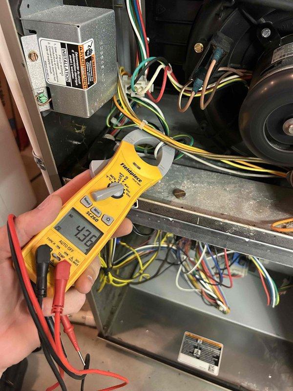 Completed scheduled Care Plan maintenance on 2012 gas furnace and air conditioning system located in basement. Performed comprehensive tune-up including visual inspection of burner assembly with all three burner ports firing properly with clean blue flames. Verified gas supply manifold and associated components including pressure switch functioning correctly. Measured electrical amperage draw at 4.98 amps, which is within normal operating parameters. Inspected blower motor, control relay, and all wiring connections for proper operation. Washable electrostatic filter was checked and system confirmed operational.