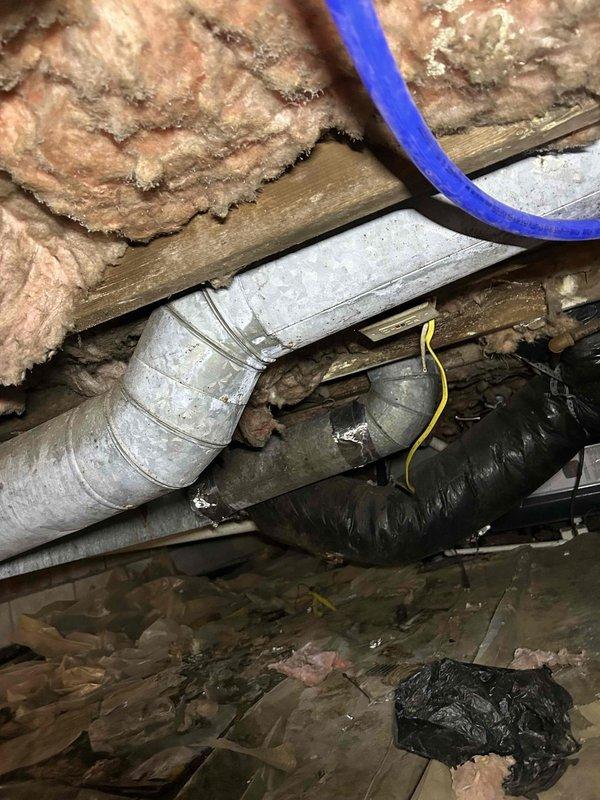 Responded to service call for ductwork repairs in crawl space. Upon inspection, identified damaged galvanized metal ductwork with compromised seams and joints requiring attention. Documented existing conditions including aged ductwork system, accumulated debris in crawl space, and insulation displacement around HVAC components. Provided detailed assessment and pricing estimate to customer for necessary ductwork repairs before proceeding with authorized work.