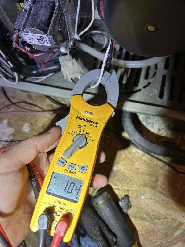 Responded to no heat call on 7-year-old gas furnace located in attic. Unit was running but blowing cold air on first heating cycle of the season. Diagnosed control board issue by inspecting electrical connections and testing current draw, which measured 1.84 amps at the time of service. Evaluated circuit board connections and wiring harnesses to identify the heating malfunction. System required further diagnostic evaluation of the control board and associated electrical components to restore proper heating operation.