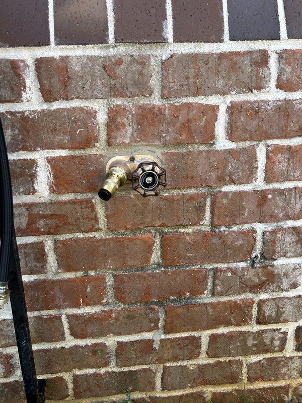 Replaced existing exterior hose bib with a Woodford Model 27 CP freeze-proof wall hydrant (8-10 inch length) on brick exterior wall. Performed tankless water heater flush service and completed comprehensive whole home plumbing inspection, identifying all accessible plumbing components and fixtures for proper operation and potential concerns.