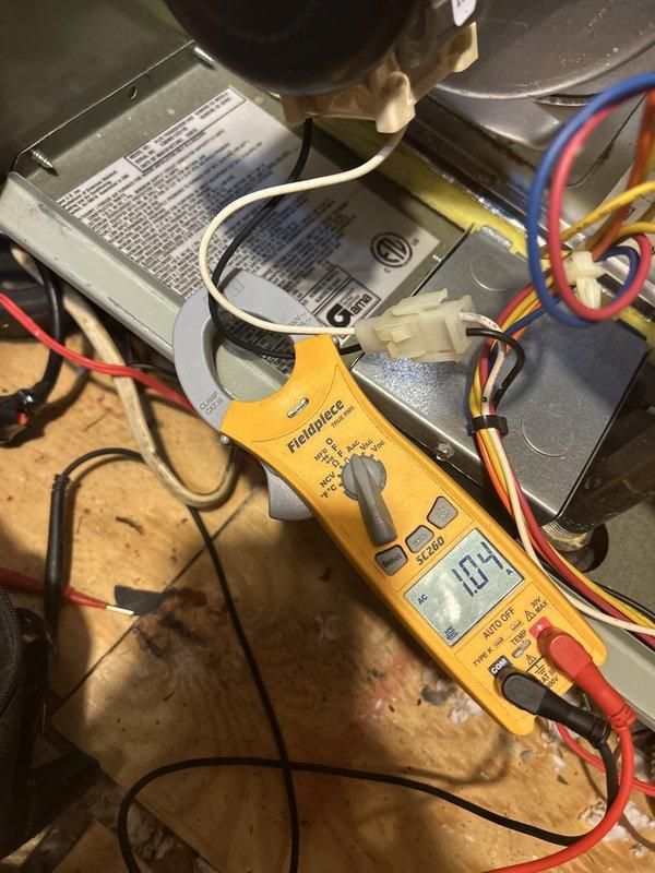 Completed comprehensive Care Plan maintenance on dual air conditioning and dual gas furnace system located in attic and basement. Performed diagnostic testing on blower motor assembly using digital clamp meter to verify proper amperage draw and electrical performance. Inspected and tested all electrical connections, motor capacitors, and wiring harnesses for both HVAC units. Verified blower motor operation and confirmed specifications against manufacturer's data plate. Examined flame sensor rod assembly, noting surface oxidation present on sensor element. Both systems operating within normal parameters following tune-up procedures. Customer provided replacement air filters for installation at both equipment locations.