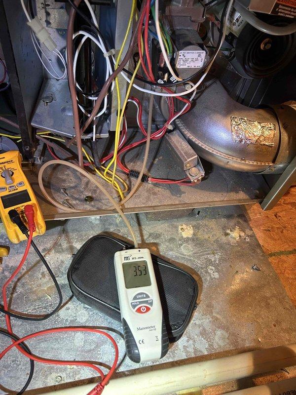 Completed comprehensive Care Plan maintenance on multi-system HVAC installation including five air conditioning units, five gas furnaces, four electronic air cleaners, and three humidifiers with replacement of three #35 humidifier pads. Performed diagnostic testing using digital manometer and multimeter to verify proper system operation and pressures, with readings indicating normal parameters at 32.5 units. Verified thermostat functionality and confirmed accurate temperature control with system maintaining 72°F setpoint in auto mode.