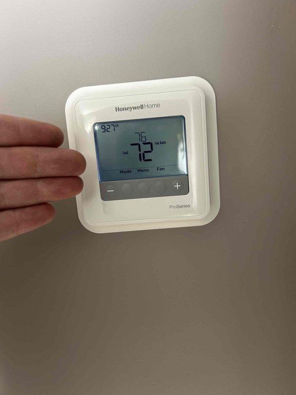 Completed comprehensive Care Plan maintenance on multi-system HVAC installation including five air conditioning units, five gas furnaces, four electronic air cleaners, and three humidifiers with replacement of three #35 humidifier pads. Performed diagnostic testing using digital manometer and multimeter to verify proper system operation and pressures, with readings indicating normal parameters at 32.5 units. Verified thermostat functionality and confirmed accurate temperature control with system maintaining 72°F setpoint in auto mode.