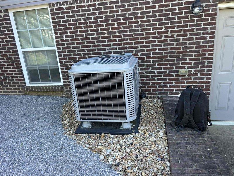 Completed comprehensive Care Plan tune-up on gas furnace and air conditioning system with furnace located in basement. Performed full system diagnostics including electrical testing with amp clamp meter showing 0.95 amp draw, inspected outdoor condensing unit positioned on platform pad, verified all electrical connections and wiring integrity, and documented equipment condition through detailed photography. All components operating within normal parameters with no issues identified during maintenance inspection.