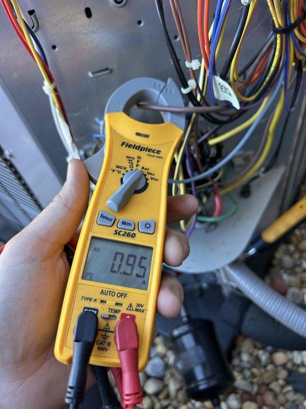 Completed comprehensive Care Plan tune-up on gas furnace and air conditioning system with furnace located in basement. Performed full system diagnostics including electrical testing with amp clamp meter showing 0.95 amp draw, inspected outdoor condensing unit positioned on platform pad, verified all electrical connections and wiring integrity, and documented equipment condition through detailed photography. All components operating within normal parameters with no issues identified during maintenance inspection.