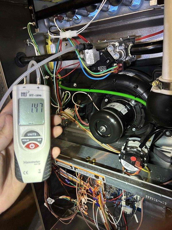 Completed Gold Level preventive maintenance on single-zone air conditioning system with gas furnace located in basement. Performed comprehensive tune-up including airflow diagnostics with digital manometer showing 147 CFM measurement at blower assembly, inspected blower motor and electrical connections with all wire terminations secure, verified proper operation of control board and safety circuits. Customer-supplied Filtrete air filter was installed in filter housing with proper sealing confirmed.