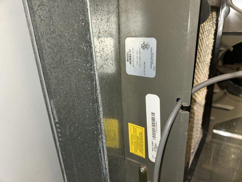 Completed routine maintenance tune-up on HVAC system located in garage closet. Performed comprehensive inspection of unit components, replaced 20x25x4 Glasfloss air filter, and documented equipment condition with photos of system labels and new filter installation.