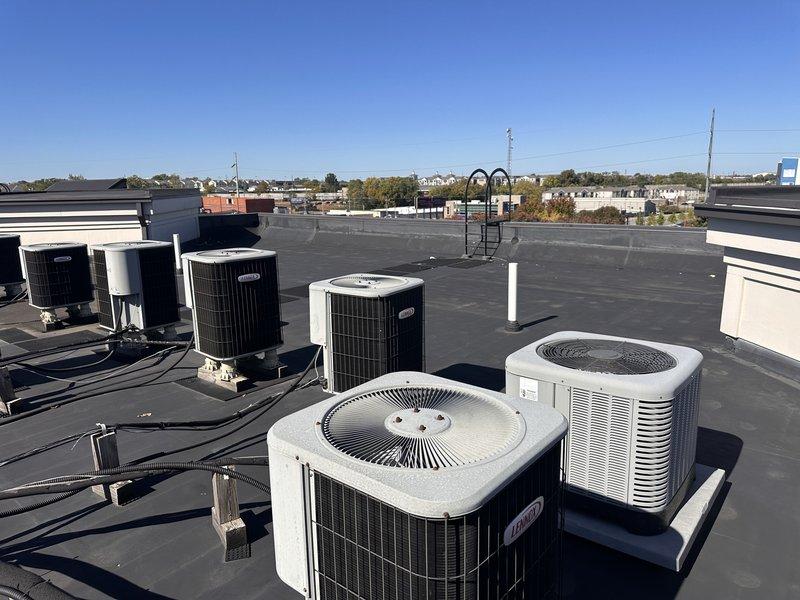 Completed full system replacement for apartment-style rooftop HVAC unit that was over 10 years old and experiencing complete cooling failure. The existing electric unit had fan operation but no cooling capacity for approximately three weeks, with indoor temperature at 73 degrees despite thermostat set to 68 degrees. Replaced entire system including rooftop condenser unit and indoor air handler located in utility closet, restoring full cooling functionality to the residential unit.