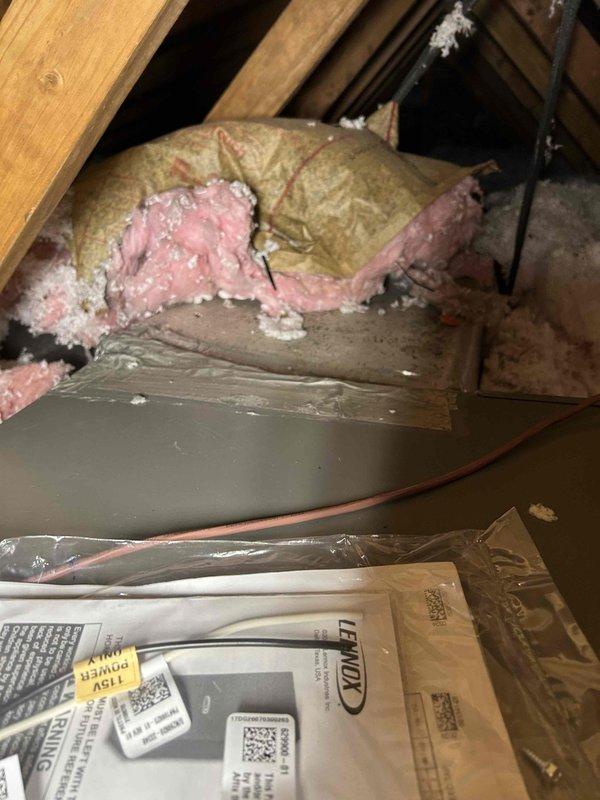Completed full residential HVAC system installation in attic space as part of promotional program. Installed Lennox ML14KP1-024-230A02 heat pump system with CBK43UHET-024-DV-01 air handler and 10KW heat kit. Removed existing return flex ductwork to facilitate equipment access and replaced with new flex upon completion. Installed Lennox L40 digital thermostat for system control.

Installed auxiliary drain pan with proper plywood support beneath air handler per code requirements. Installed condensate trap and verified condensation line is clear and flowing properly throughout entire drainage system. Installed safety switches on equipment. Replaced standard 1" pleated air filter.

Performed comprehensive ductwork sealing throughout entire attic duct system to eliminate air leakage and improve system efficiency. Inspected all duct connections and sealed penetrations to ensure proper airflow and system performance. Verified all equipment is properly secured, leveled, and operational. System