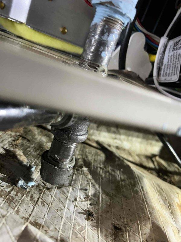 Completed callback to address post-installation items including documentation of furnace drip leg and shut-off switch installations per code requirements. Photographed gas line drip leg assembly and electrical disconnect switch in attic space showing proper code-compliant installation. Reconnected dryer vent ducting at crawlspace entrance that was inadvertently left disconnected during original equipment installation. Secured loose brick at exterior foundation back to original position to restore structural integrity at affected area.