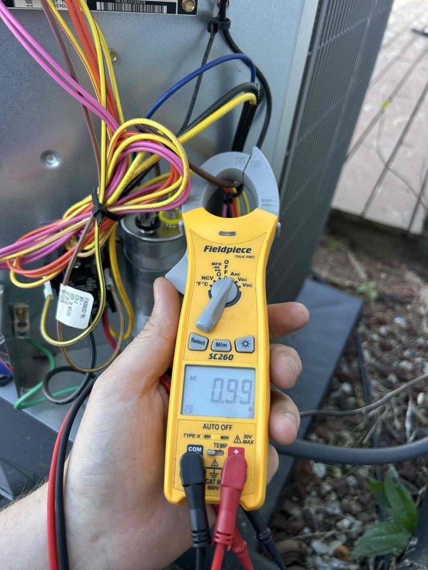 Performed comprehensive HVAC maintenance on heat pump/air handler system located in garage. Conducted electrical diagnostics using calibration meter, measuring voltage and amperage readings at the outdoor condenser unit to verify proper system operation. Inspected outdoor condenser unit positioned on concrete pad, checking fan operation, coil condition, and overall equipment functionality. Verified all electrical connections and components including capacitor. System operating within normal parameters upon completion of maintenance inspection. Customer provides their own air filter sized 16 3/8 x 21 1/2 x 1 inch.