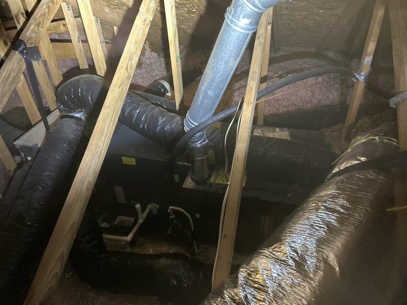 Completed comprehensive air conditioning tune-up and maintenance inspection on attic-mounted air handler unit as part of club membership care plan. Performed standard preventive maintenance procedures including filter inspection, electrical connections check, refrigerant level verification, condensate drain assessment, and ductwork examination. All HVAC components, flexible ductwork, and distribution system connections were found to be in functional operating condition with normal dust accumulation typical for attic installations.
