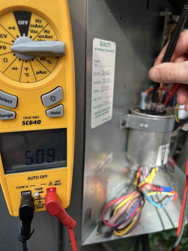 Completed Gold Level prepaid maintenance on single-system HVAC unit. Performed comprehensive diagnostic testing using digital multimeter to verify electrical parameters, measuring voltage at 5.89V and capacitance reading of 418.17 μF on system components. Inspected control wiring, tested all electrical connections within air handler cabinet, and documented system operation for quality assurance records.