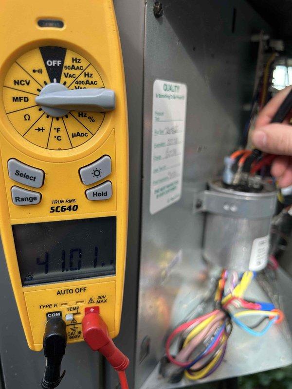 Completed Gold Level prepaid maintenance on single-system HVAC unit. Performed comprehensive diagnostic testing using digital multimeter to verify electrical parameters, measuring voltage at 5.89V and capacitance reading of 418.17 μF on system components. Inspected control wiring, tested all electrical connections within air handler cabinet, and documented system operation for quality assurance records.