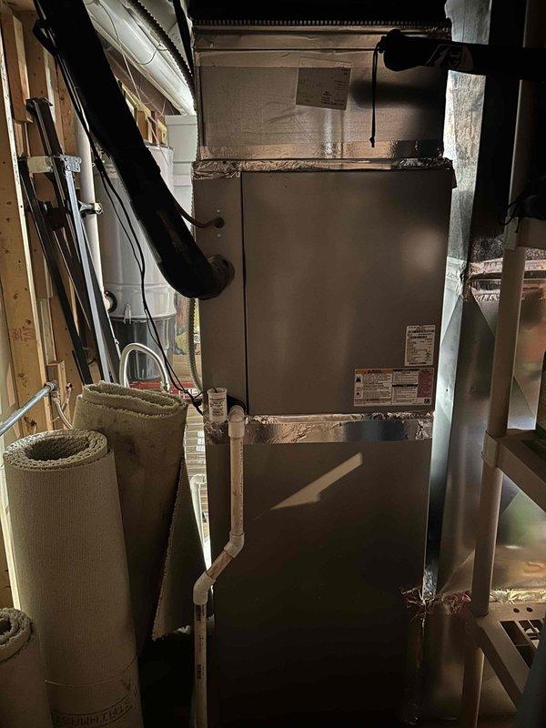 Completed installation of Bryant 100K BTU two-stage 97% AFUE Evolution gas furnace model 987TA66100C21 in residential basement location. Removed and properly disposed of existing furnace equipment, then positioned and secured new unit with all necessary ductwork connections, including metallic supply plenum and flexible return air ducting. Installed copper refrigerant line connections to integrate with existing air conditioning system, ensuring compatibility with current wall thermostat control. Completed all electrical connections, gas line hookup, and combustion venting per manufacturer specifications and local code requirements. Applied required permits and performed final system testing to verify proper two-stage operation, airflow, and safety controls. System is fully operational and compatible with existing second-floor HVAC equipment.