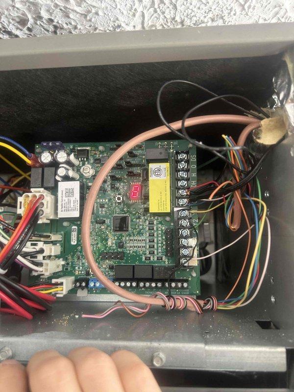 Responded to no-heat and no-cooling call on recently installed system. Upon arrival, found unit unable to heat and compressor failing to engage when switched to cooling mode. Accessed control board and diagnosed reversing valve and compressor lockout issues. Referenced manufacturer configuration and alarm codes from Lennox technical documentation to troubleshoot control board errors. Verified wiring connections at terminal strips and inspected low-voltage circuits. Cleared fault codes, tested system operation through multiple heating and cooling cycles to confirm proper reversing valve operation and compressor engagement. System restored to full heating and cooling functionality under warranty.