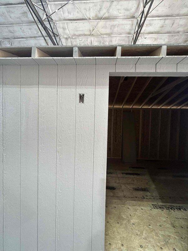 Installed a new 100-amp panel with branch circuit breakers (including additional single-pole and 2-pole units) and wired the outbuilding with GFCI and duplex receptacles, four single-pole switches, a weatherproof receptacle, and a 30-amp 240V receptacle with cover. Roughed in cable runs and boxes for four 4" LED wafer lights, two exterior sconces, and a chandelier (wiring only, for customer to hang). Rough-in was completed for inspection, with a return trip to be made to install devices and finish the work.