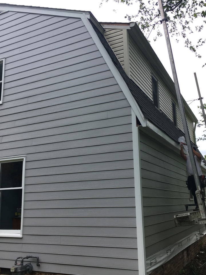 See contrast of old vinyl siding above and new James Hardie siding below. Fiber cement siding looks much more authentic. 