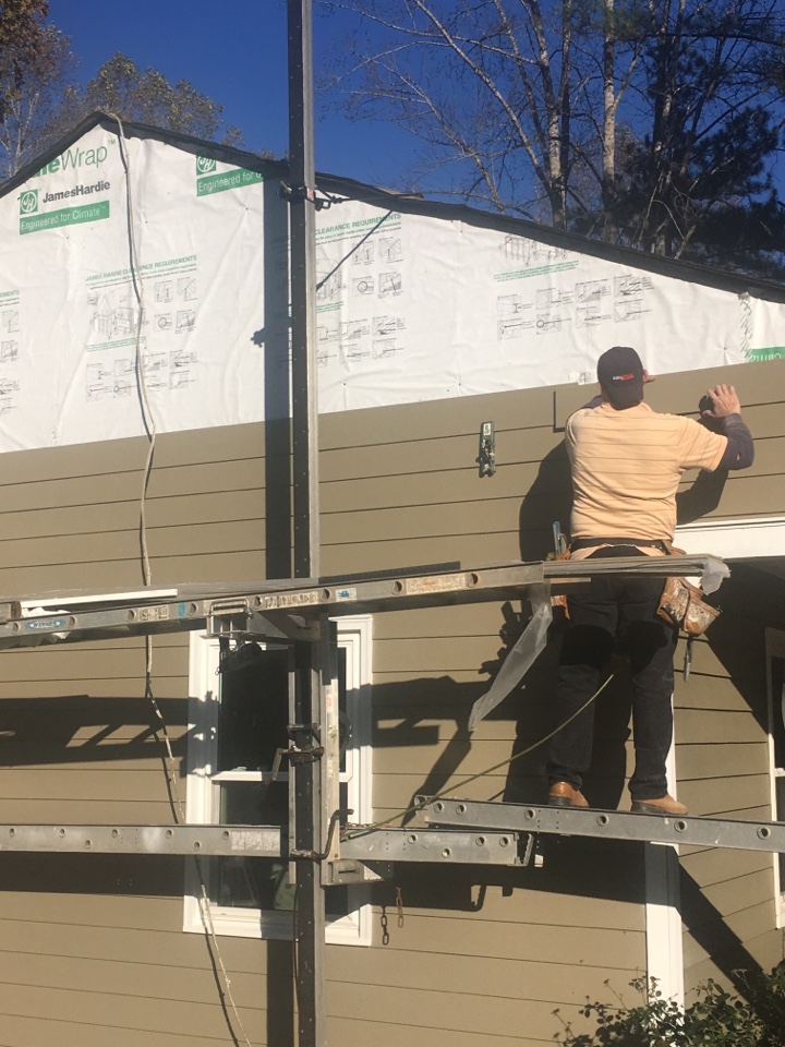 James Hardie lap siding replacing old cedar siding. This rancher had an original 6” exposure on the cedar. We are replacing with 6” HardiePlank, Woodstock Brown. 