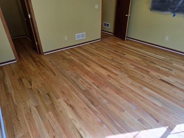 We installed new red oak hardwood and finished with a natural stain at this home in Lineville. We installed new red oak hardwood and finished with a natural stain at this home in Lineville.