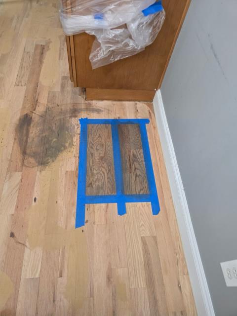 Refinishing solid hardwood floors in Winston, GA. Putting down stain samples for client. 