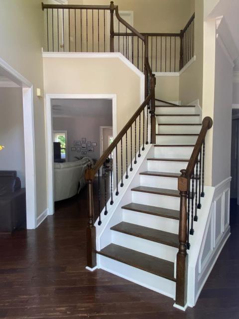 Installed new treads, spindles, and repaired handrails on this staircase. Stained and finished the treads, posts, and rails at this home in Norcross, GA.  Installed new treads, spindles, and repaired handrails on this staircase. Stained and finished the treads, posts, and rails at this home in Norcross, GA.