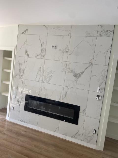 Tile install around fireplaces, at these townhomes in Avondale Estates, GA.