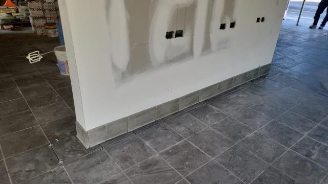 Completing a job installing floor and wall tile in Lawrenceville, GA.