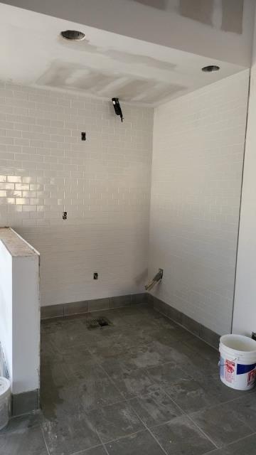 Completing a job installing floor and wall tile in Lawrenceville, GA.
