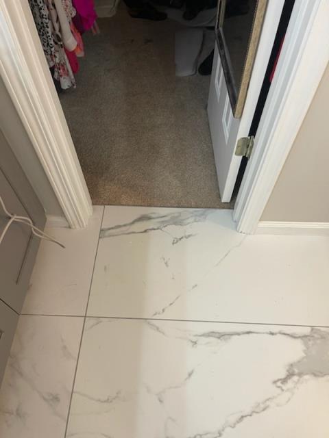 At this home in Alpharetta, GA, where we shaved down a laundry room door and repaired some carpet.