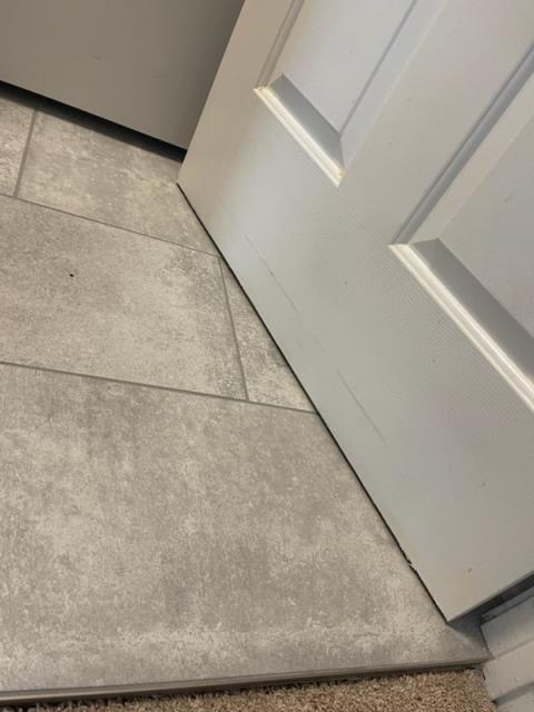 At this home in Alpharetta, GA, where we shaved down a laundry room door and repaired some carpet.