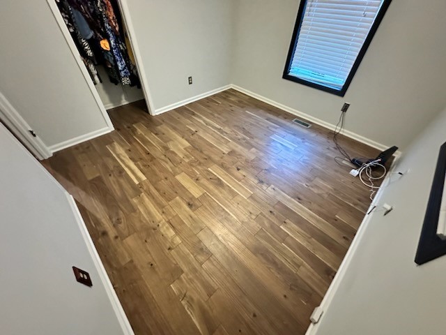 Demoed carpet in several rooms and installed prefinished solid hardwood, at this home in Powder Springs, GA. 