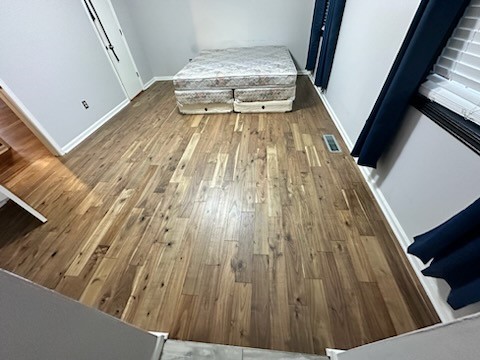 Demoed carpet in several rooms and installed prefinished solid hardwood, at this home in Powder Springs, GA. 