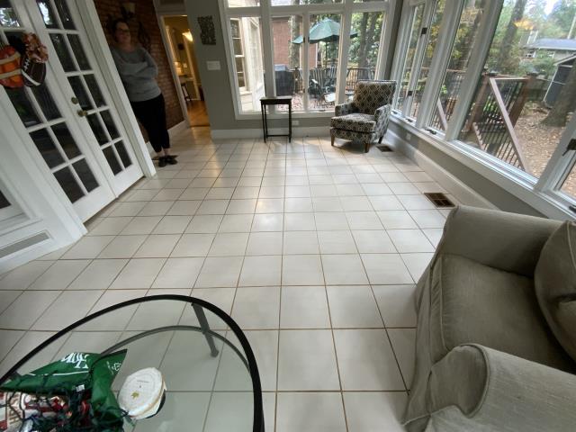 Tearing out old tile and installing new wood look tile. Decatur, GA.