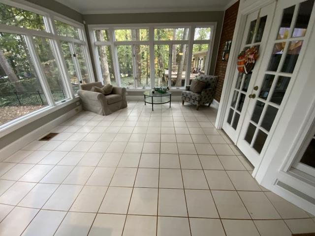 Tearing out old tile and installing new wood look tile. Decatur, GA.