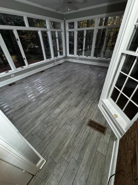 Installation of tile at this homes sunroom in Decatur, GA. 