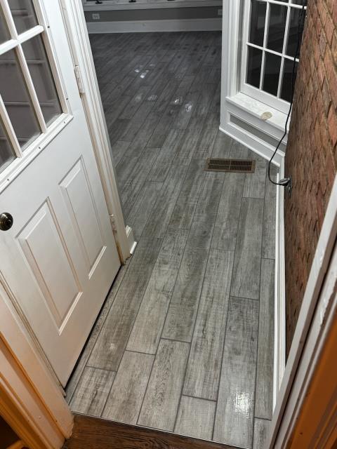 Installation of tile at this homes sunroom in Decatur, GA. 