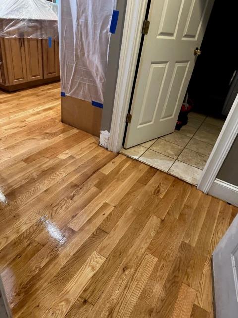 Installed additional white oak hardwood in this home in Duluth, GA and then sanded and finished the wood throughout the home.