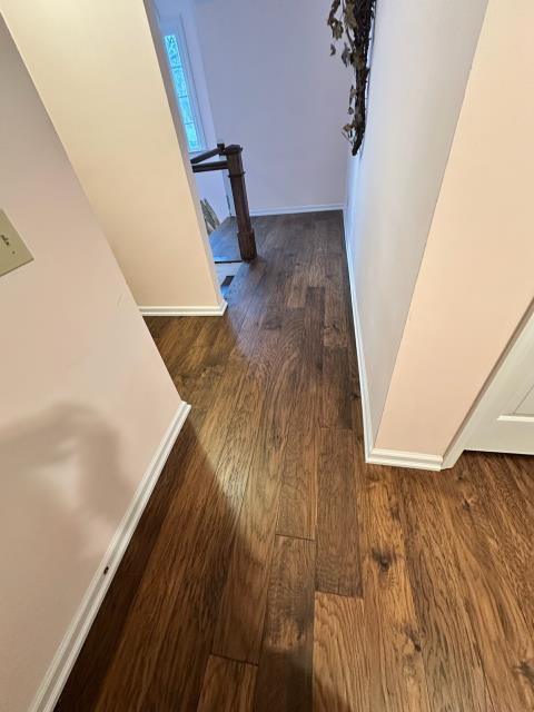 We installed new engineered hardwood and stained the new stair parts to match at this home in Roswell, GA.